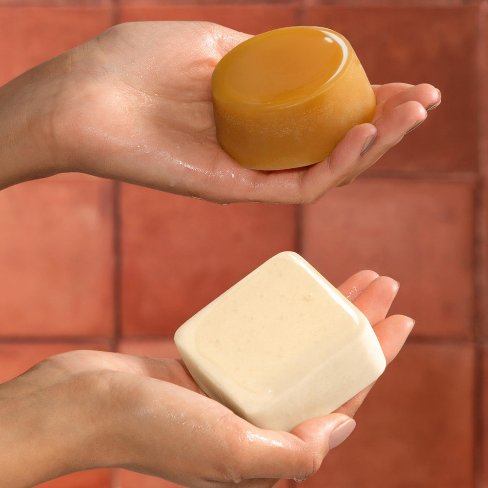 Dip full size conditioner and shampoo bars in hands size reference